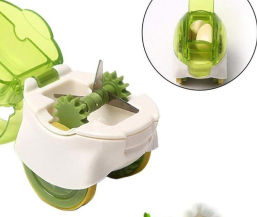 A hand comfortably holding the Push Garlic Crusher, highlighting the ergonomic design. The backdrop is a clean, modern kitchen counter. Soft, diffused lighting showcases the contours of the handle and the ease of grip. Focus is on the hand-tool interaction, promoting user-friendliness. Styled to suggest a professional cooking environment.