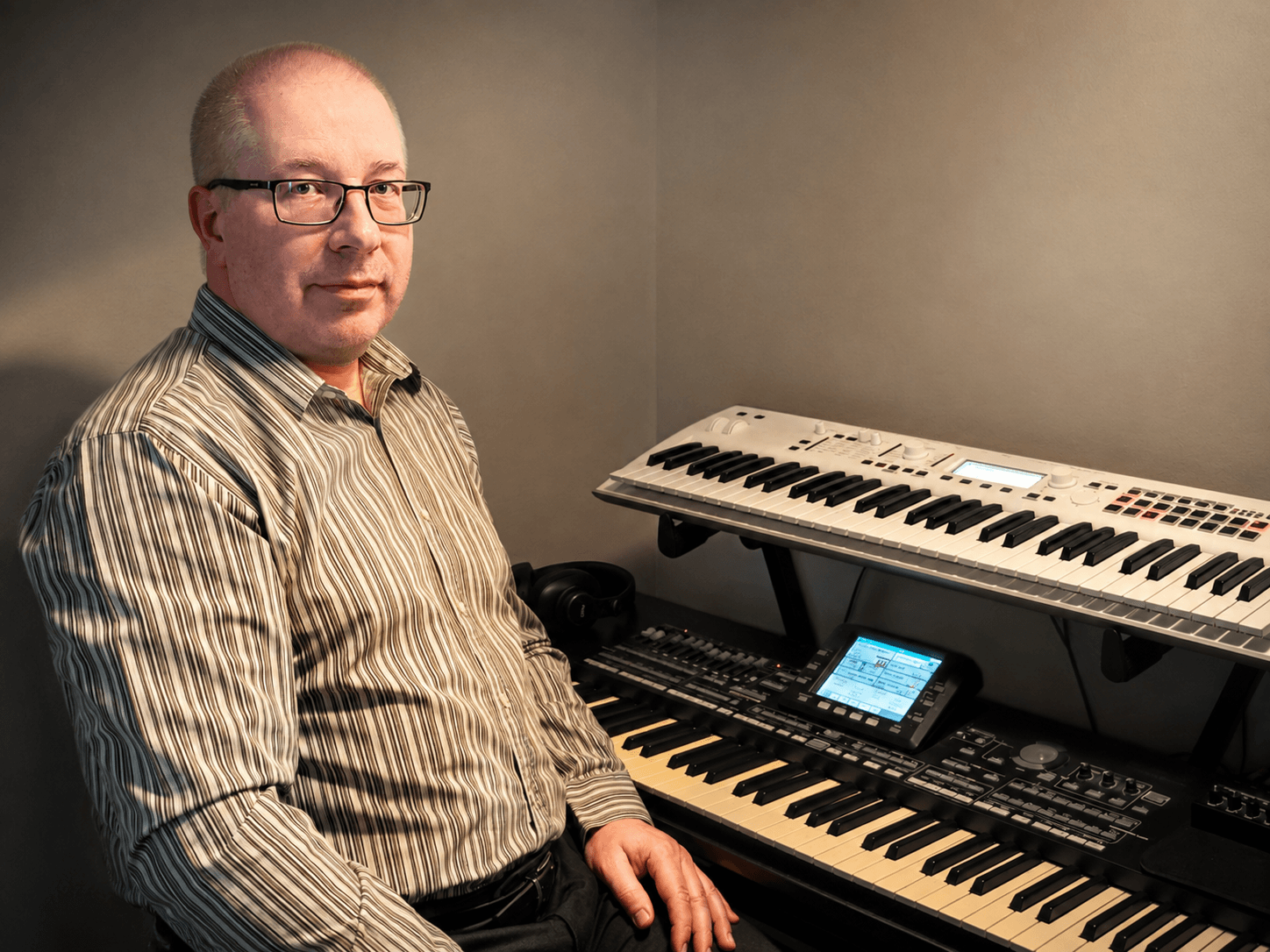 Sven Saksakulm in his home studio with keyboards and synthesizers