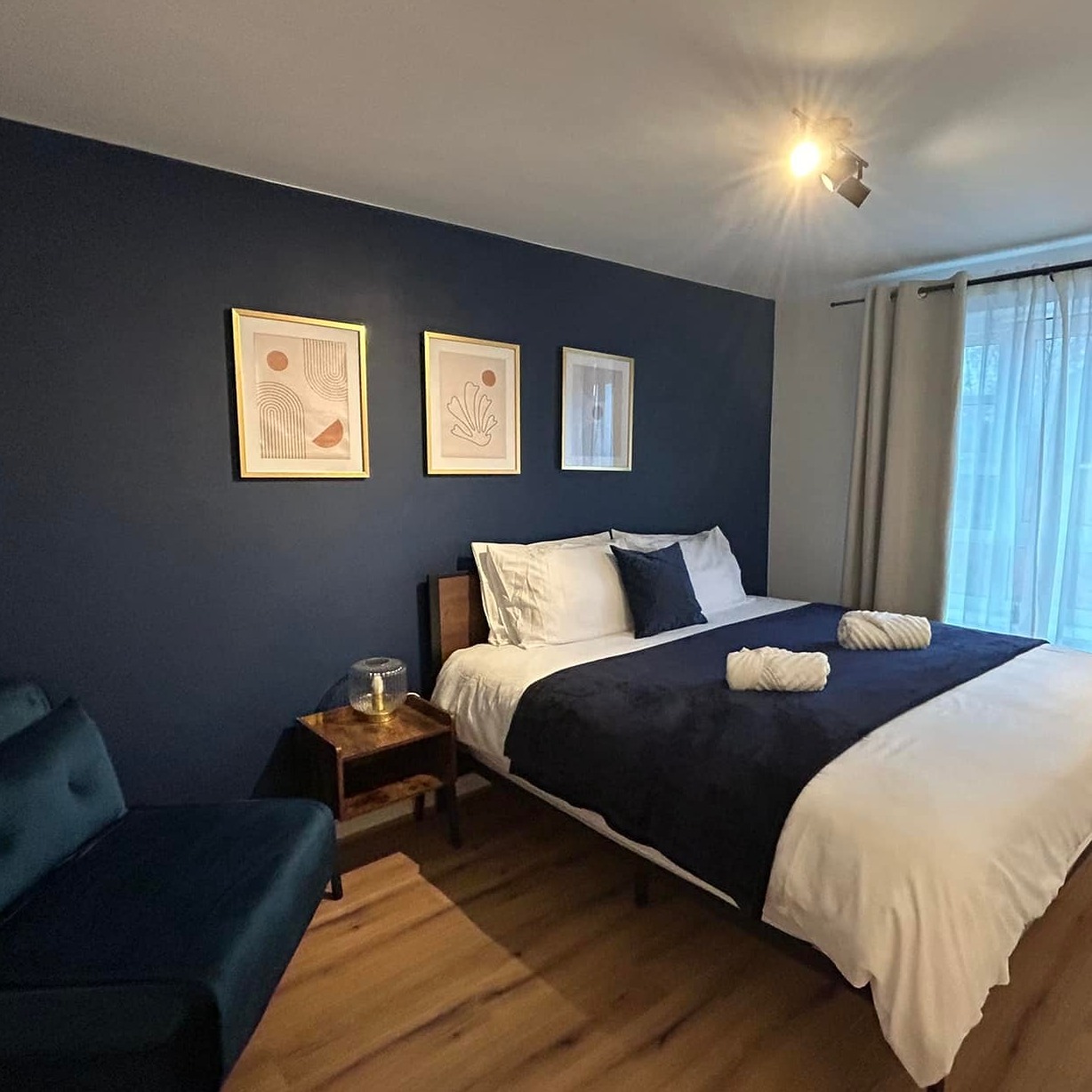 A clean and organized bedroom after a thorough cleaning.  Notice the attention to detail and the overall feeling of freshness and cleanliness.