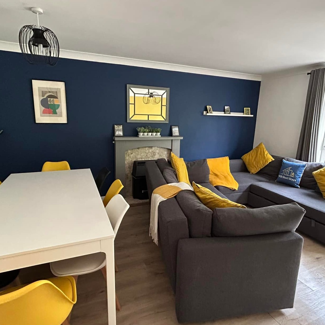 A photorealistic image of a happy family playing in a bright, spotlessly clean living room.  Sunlight streams through large windows, illuminating dust-free surfaces.  The scene should evoke feelings of warmth, comfort, and health.  High resolution, 8k quality, detailed textures, vibrant colors, sharp focus.