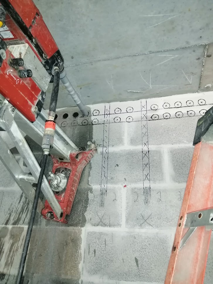 Use a wide shot to illustrate the diverse range of applications where concrete core drilling is useful. The photo should feature varied scenes such as constructing buildings, road works, and building renovations. The editing style should be consistent but varied in each scene to emphasize the wide scope of our work.