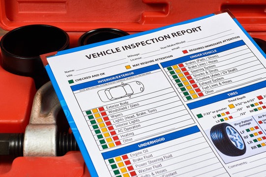 Create a photorealistic, ultra-high quality hero image for Amar Distributors Ltd., a vehicle inspection and auto repair service. The image should showcase a modern, clean inspection bay with a vehicle undergoing inspection. Focus on the precision and technology involved in the process. Include mechanics in professional attire, using diagnostic tools. The lighting should be bright and even, highlighting the cleanliness of the environment. The color palette should consist of blues, grays, and whites, conveying trust and reliability. Consider a low-angle shot to emphasize the vehicle and the expertise of the mechanics. Add texture details to the tools, vehicle, and the mechanics' uniforms. The environment should be a state-of-the-art facility. The style should be similar to professional automotive photography, emphasizing clarity and detail. Render in 8K resolution with hyperrealistic detail.