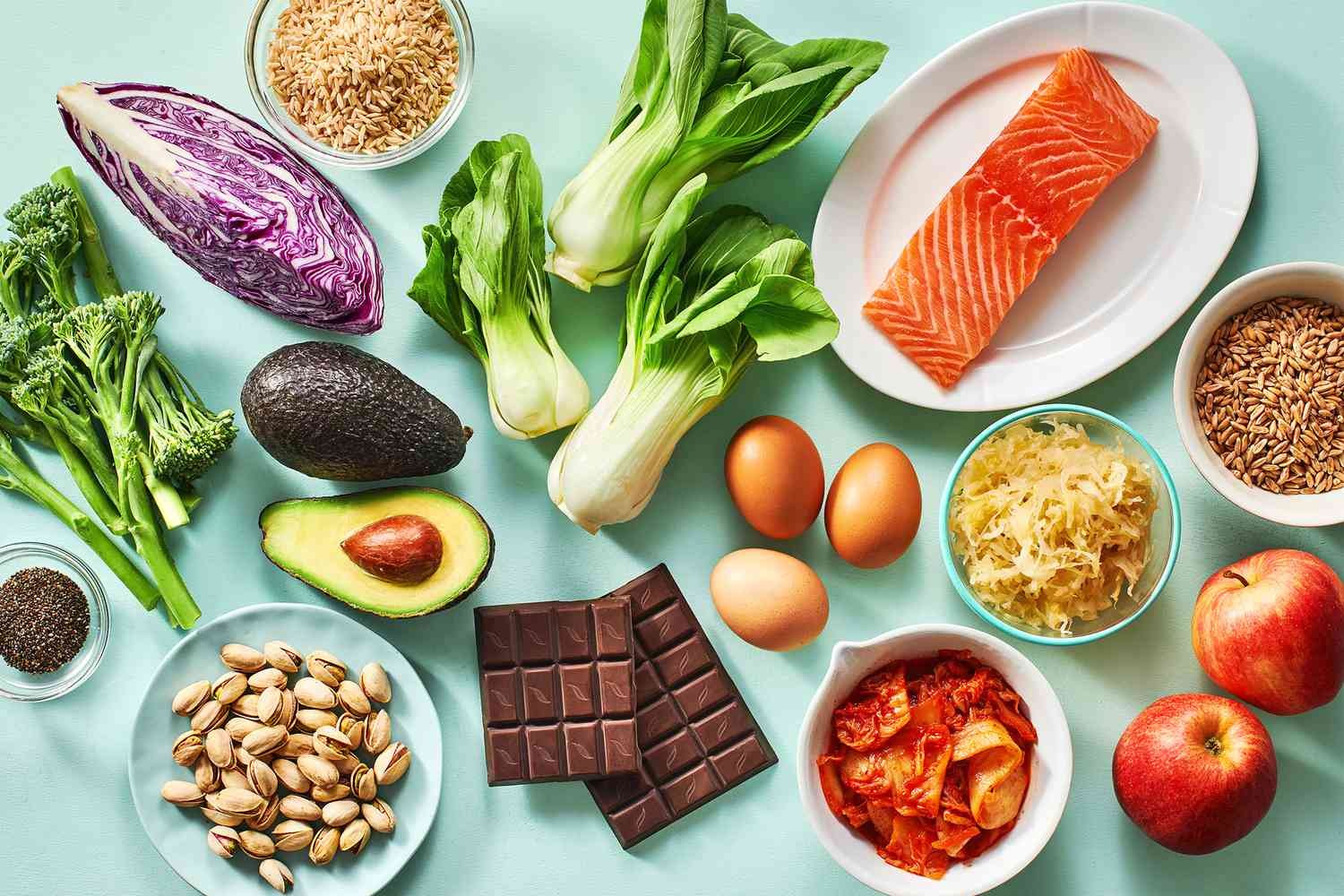 A photorealistic image of a diverse group of people happily eating a variety of healthy and delicious meals.  The meals should be colorful and appetizing, clearly showing portion control. The background should be bright and airy, suggesting a healthy lifestyle. High resolution, detailed textures, vibrant colors, studio lighting