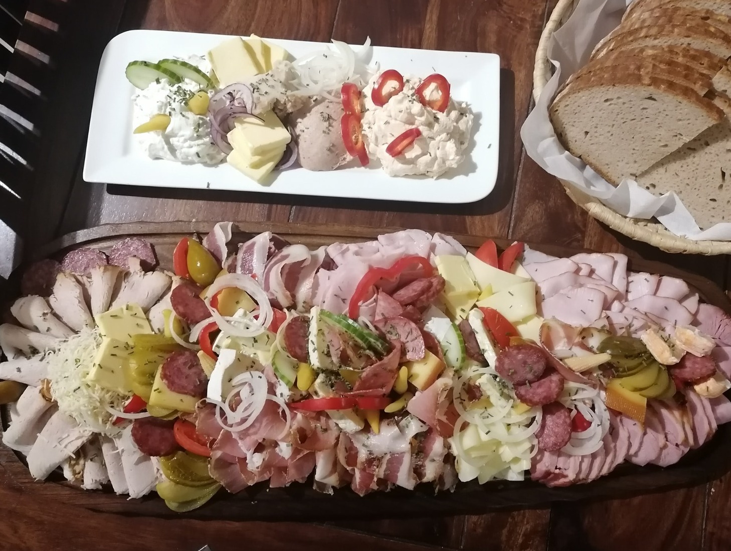 A stylized image of a piggy bank overflowing with coins, with a fork and knife resting on top. The image should symbolize affordability and value for money.