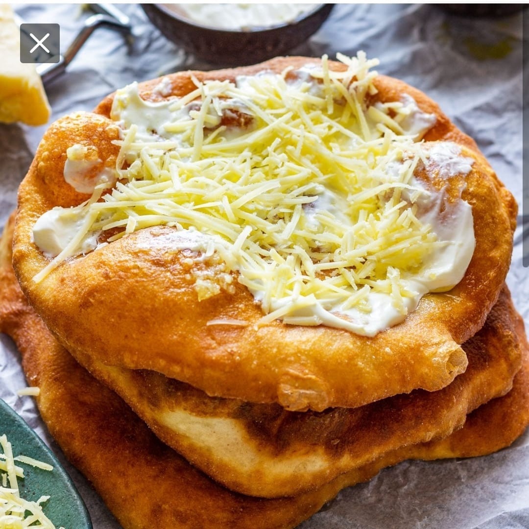A chef's hands carefully arranging ingredients on a plate, demonstrating their culinary skills and attention to detail. The image should convey creativity and artistry.