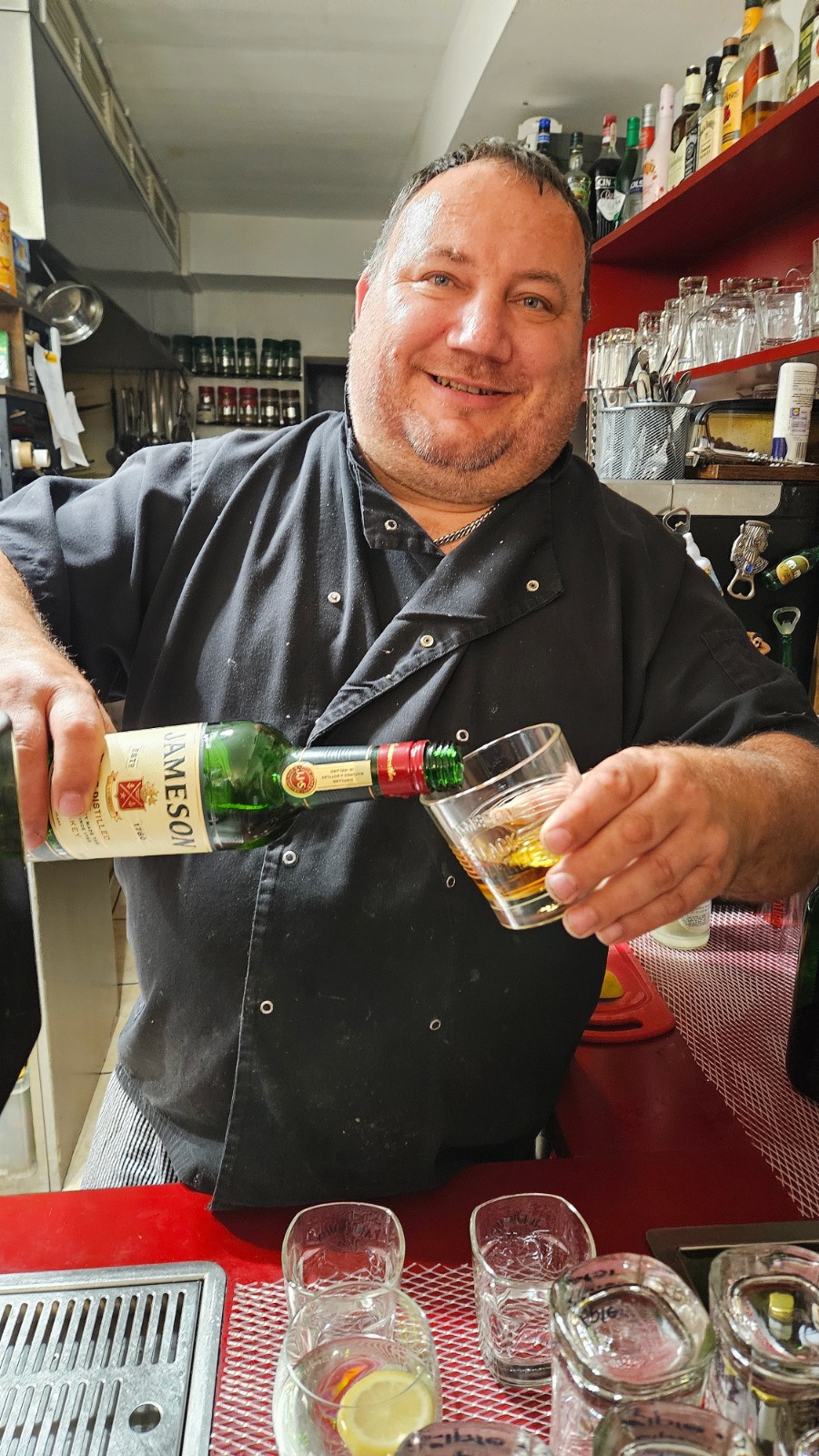 Close-up shot of a chef carefully selecting fresh ingredients from a market stall. Focus on the vibrant colors and textures of the produce, emphasizing its freshness and quality.