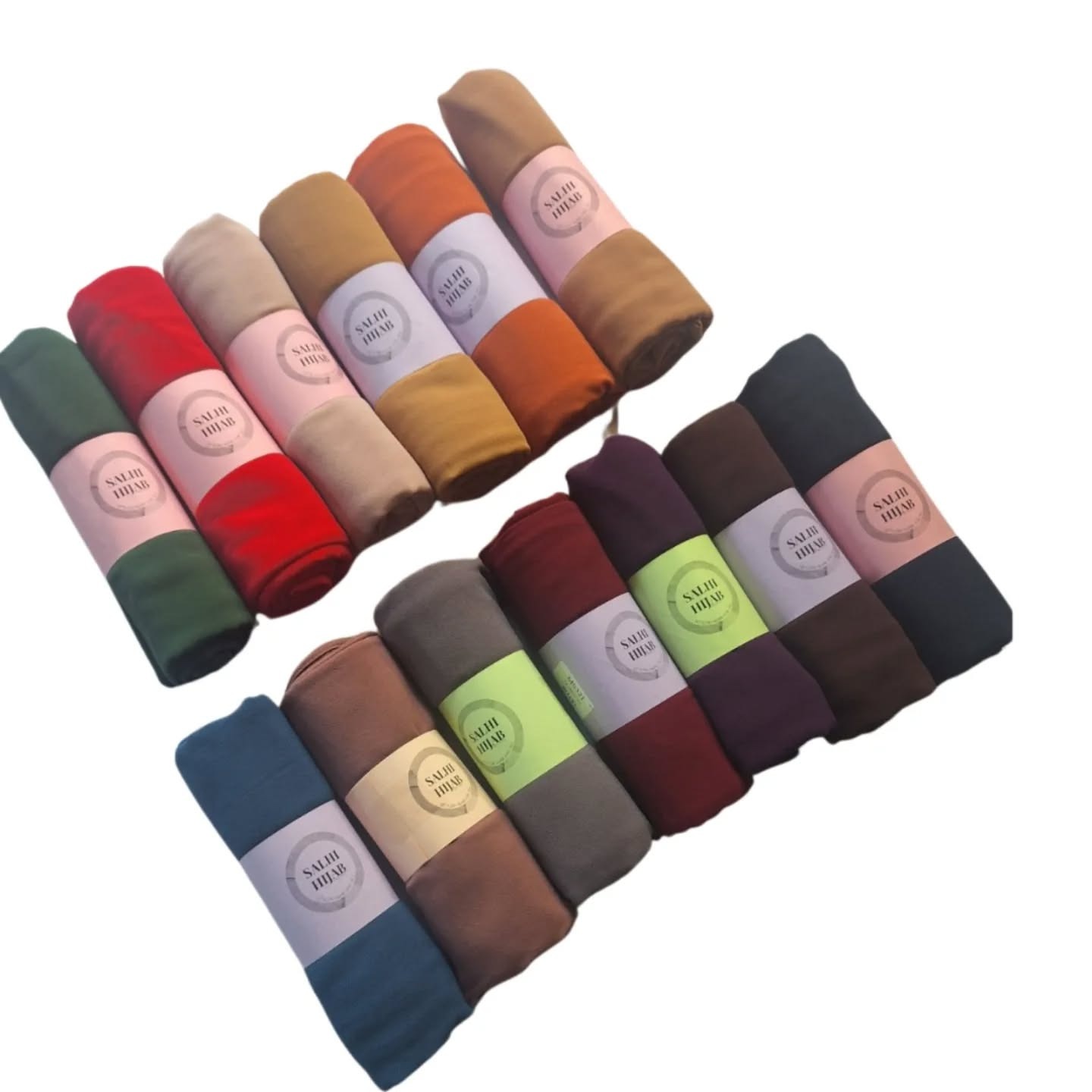 A photorealistic image of a stylist helping a client choose a hijab. The stylist is holding up different hijab styles, and the client is smiling. The lighting is warm and inviting. The color palette is soft and feminine. The setting is a stylish boutique. Technical specs: high resolution, shallow depth of field, focus on the interaction between the stylist and client.