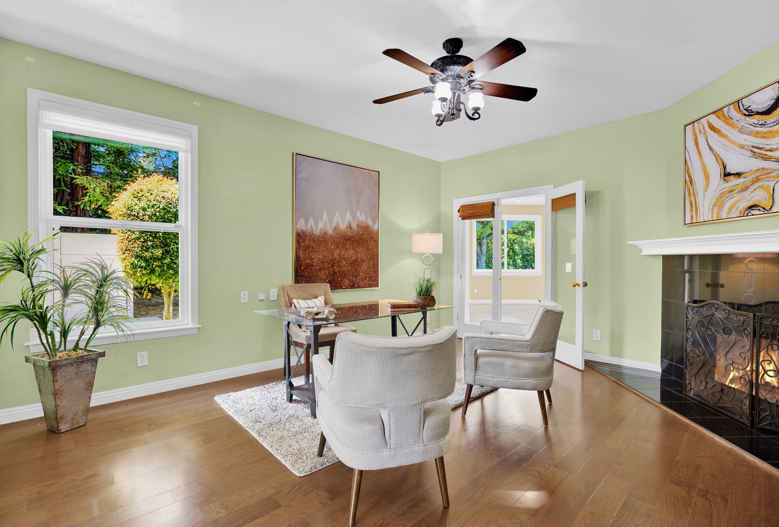 A lively photorealistic image illustrating a virtual reality scenario where a family is interacting with a staged home environment from their VR headsets. The setting is bright and colorful, with visuals presenting different design choices, showcasing various color themes and furniture styles. The joyful expressions on the family members’ faces reflect excitement and engagement. The surrounding virtual space should feel expansive and immersive, representing the potential for personalization in the home-buying experience through innovative staging.