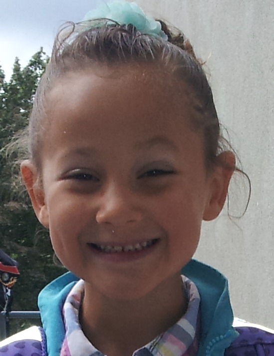 Create a captivating visual representing a 'highlight reel' of Ester Elin Lima Amdal's sixteenth year. Imagine a filmstrip overflowing with vibrant, candid photos and snippets of video clips. The images should depict key moments: laughing with friends, achieving personal goals, exploring new places, and celebrating milestones. The filmstrip should be dynamically arranged, perhaps spiraling or cascading down the screen, drawing the viewer's eye. Use a warm, nostalgic color palette to evoke a sense of cherished memories. Add subtle effects like light leaks or vintage film grain to enhance the feeling of nostalgia.