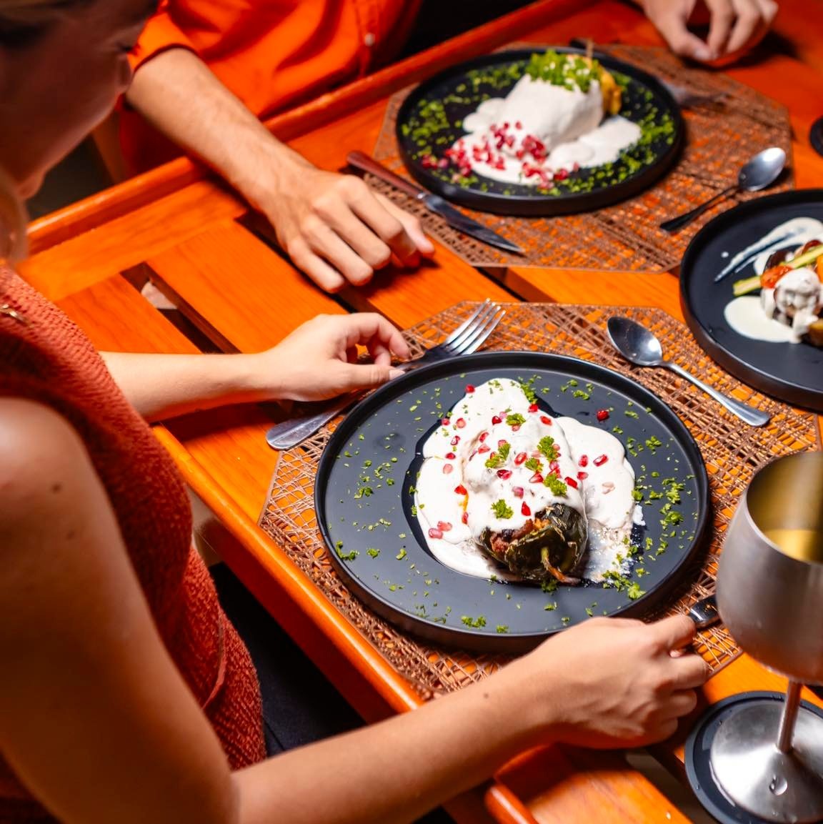 A photorealistic image of a beautifully plated meal served on the Beauport yacht, showcasing fine dining, with attention to detail.
