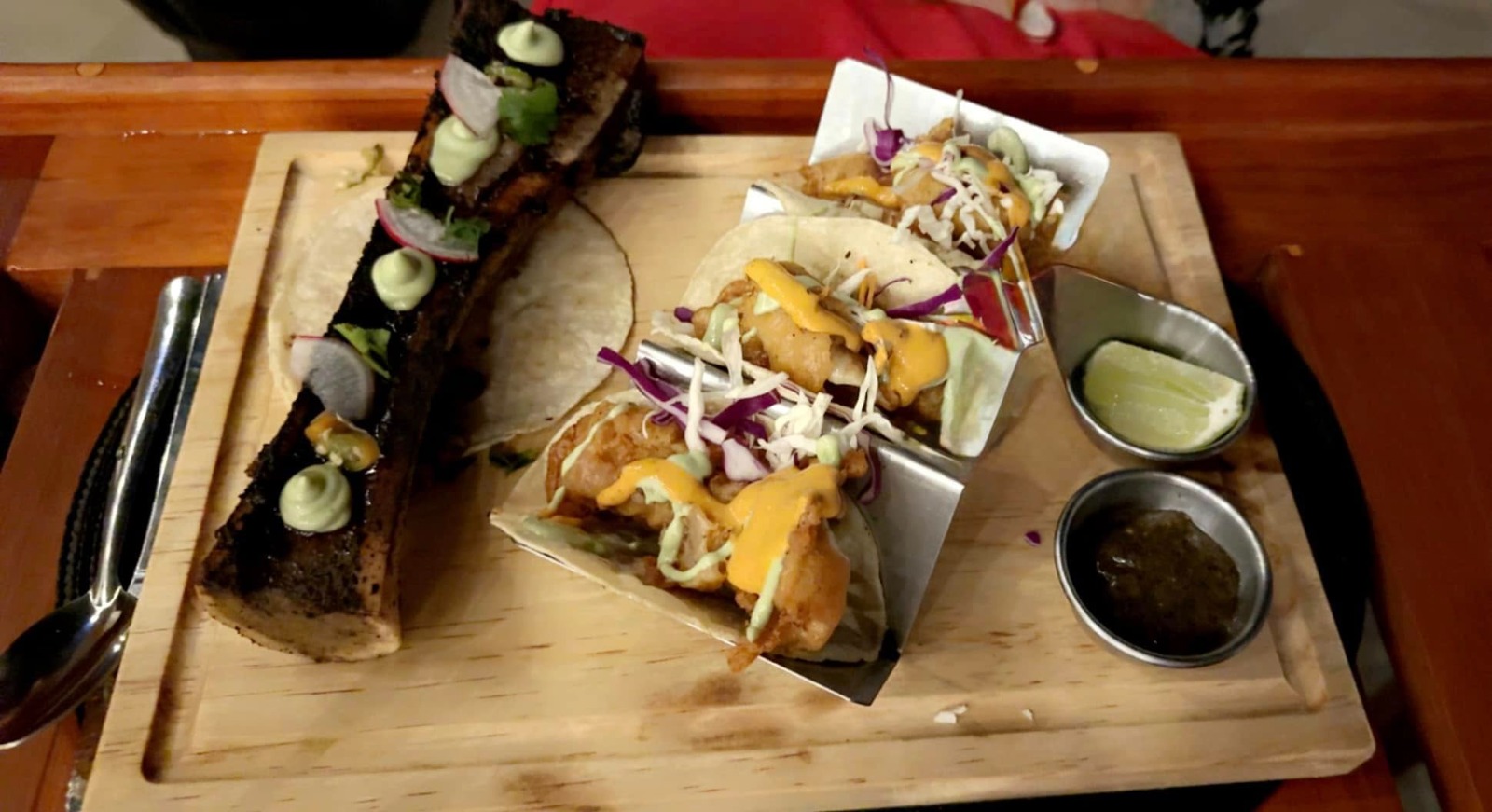 A photorealistic close-up image of several premium beverages served in elegant glassware. Show the yacht's elegant interior as a blurred background.