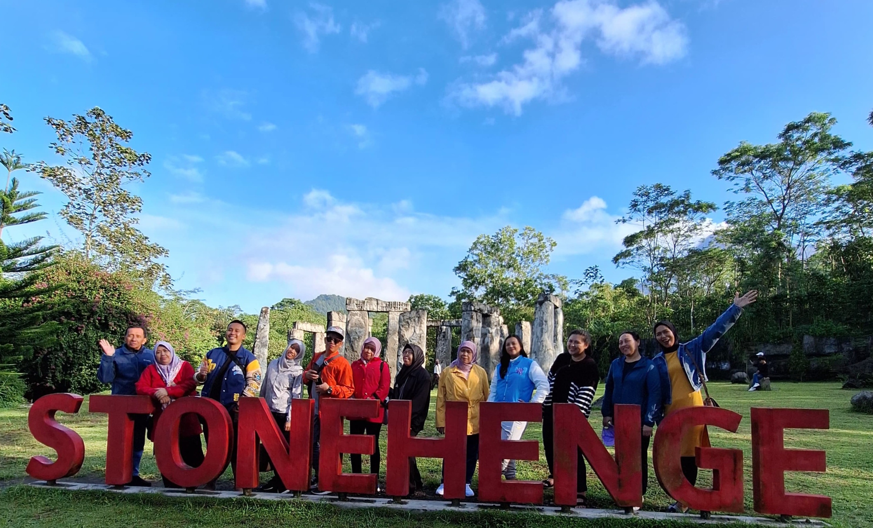 An exhilarating image showing the Jeep making a steep climb towards Mount Merapi, with the landscape unfolding into vast views. The feeling of adventure should be palpable, with adventure-seeking tourists in the vehicle showing excitement. The background should feature panoramic views of the surrounding valleys and the volcano, with bright blue skies enhancing the atmosphere. The textures of the rugged trails and the shiny surface of the Jeep should be detailed. This photorealistic representation should convey the rush of adventure.