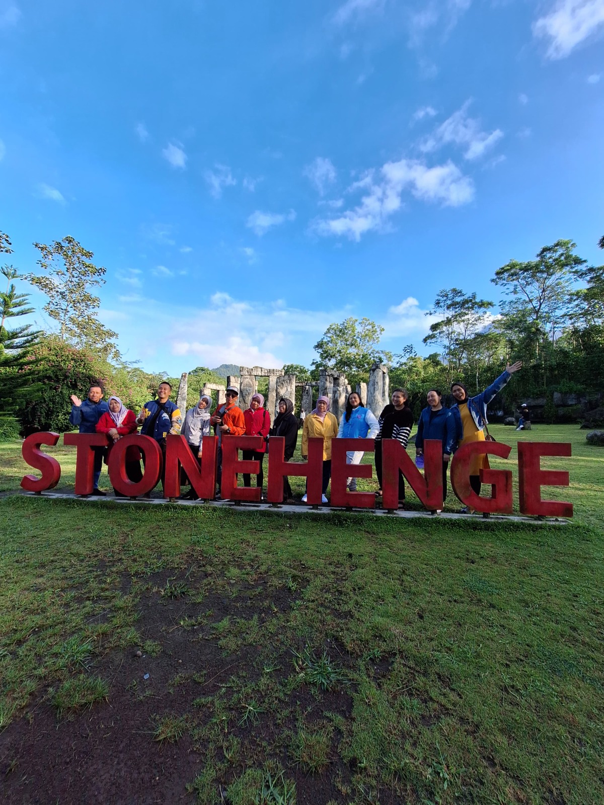 A dynamic and energetic image capturing the excitement of Jeep racing on off-road trails near Mount Merapi. The focus should be on the Jeep kicking up dust and gravel as it navigates steep slopes. The background features blurred greenery and volcanic rocks, creating a sense of speed. Shimmering sunlight highlights the dust particles, adding to the thrilling atmosphere. The angle should evoke motion, with a wide field of view that showcases the rugged landscape, capturing the thrill and adventure of the journey.