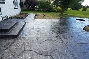 A photorealistic image showcasing the foundation of a new house under construction with concrete walls being formed. Include a crane in the background and several construction workers. Use daytime lighting and a neutral color scheme to create a realistic and industrial feel.