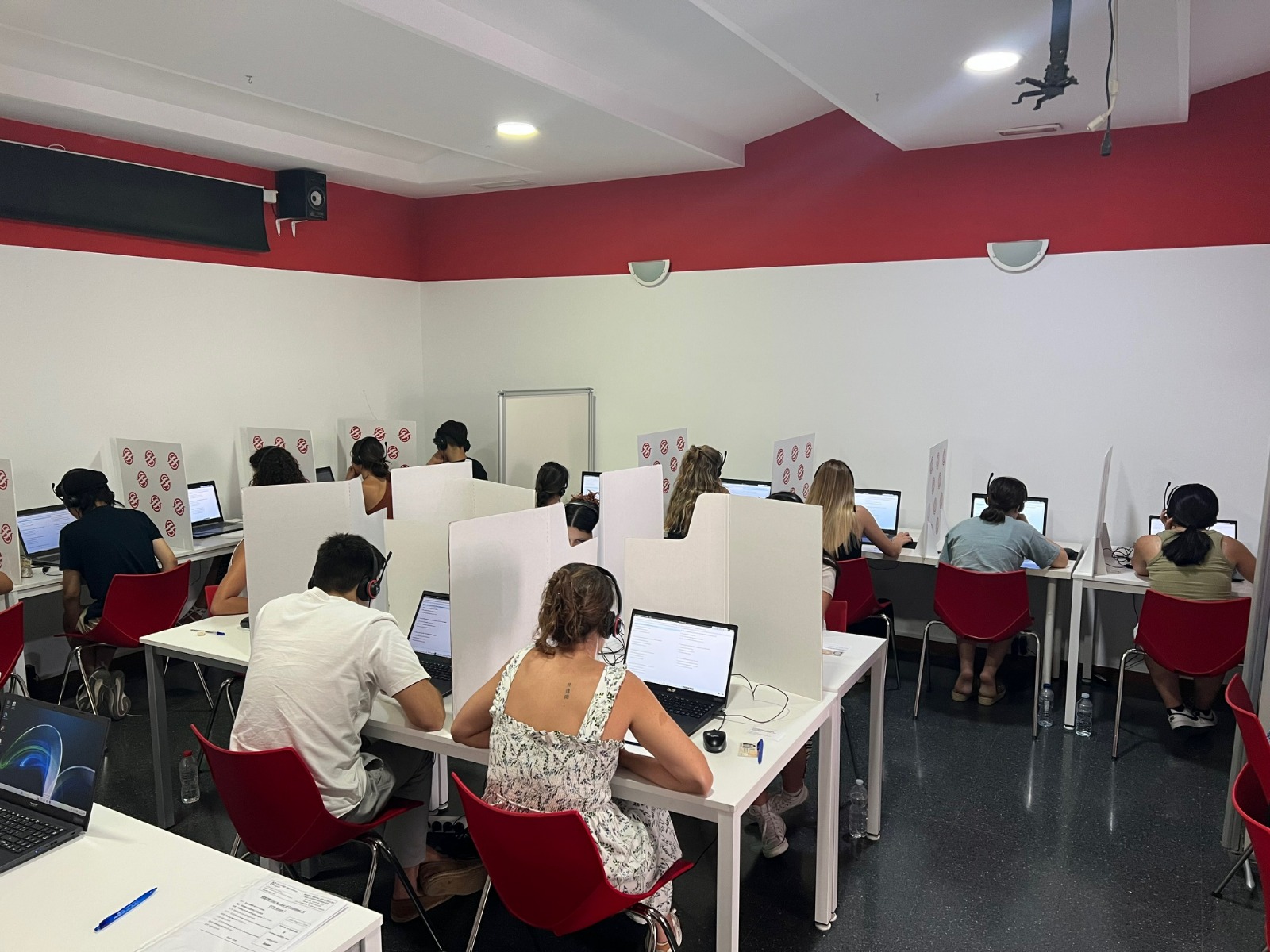 A stylish, dynamic image showcasing a motivational educational environment. The scene depicts a modern classroom filled with engaged students collaborating on STEM projects in groups. Bright colors dominate, with a vibrant energy resonating through the room. Natural sunlight illuminates the space, accentuating the students' expressions of curiosity and excitement. Relevant props include experimentation equipment and presentation boards. The camera should capture a wide-angle view that includes both students and their projects, rendered in high quality at 4K resolution.