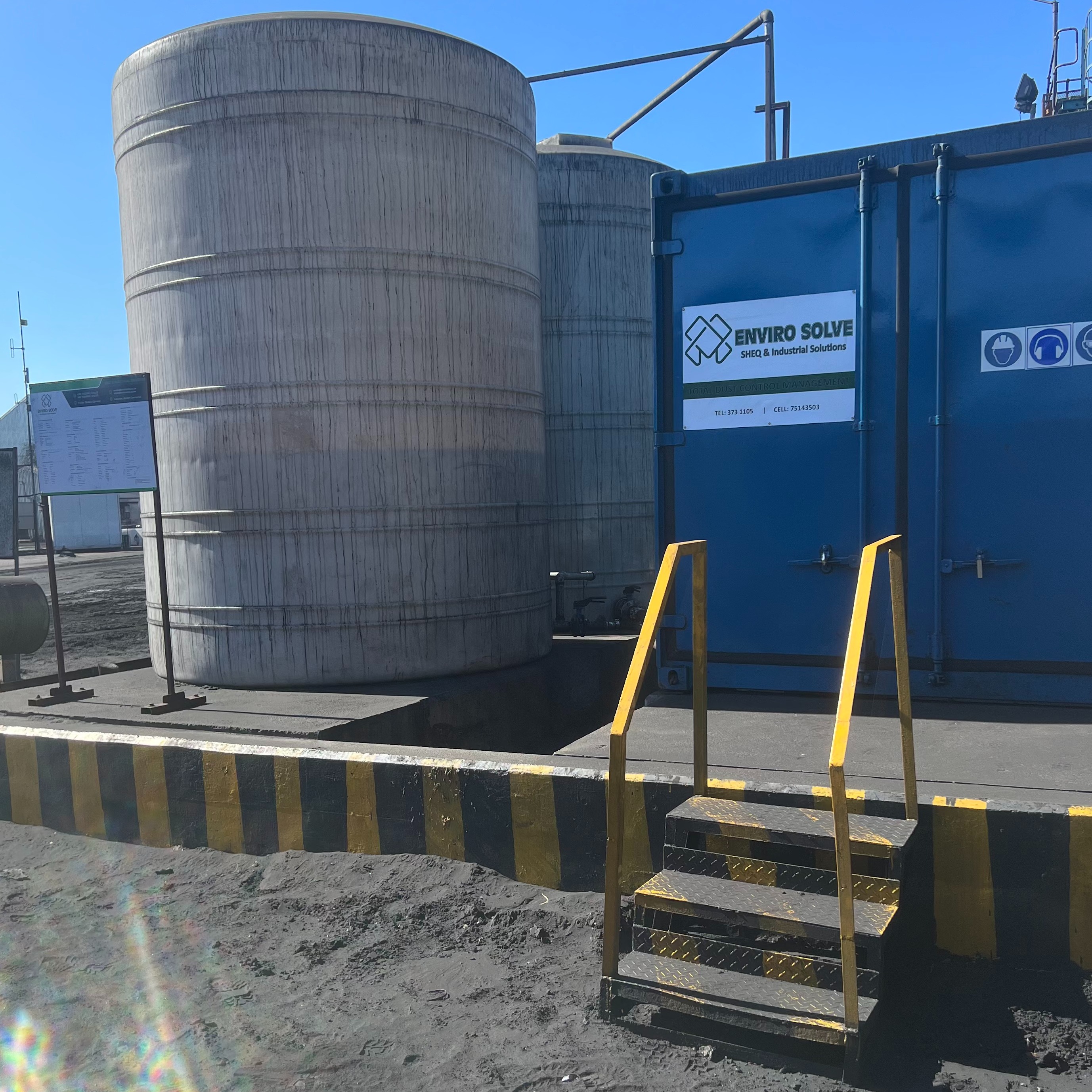 A photorealistic image showcasing advanced environmental monitoring equipment in a natural setting. Include sensors measuring air and water quality, drones collecting data, and a team of scientists analyzing the results. The lighting should be natural and highlight the importance of the environment. The color palette should be calming and informative, emphasizing the health of the ecosystem.