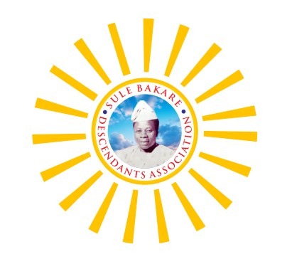 A photorealistic 4K image representing the SBDA's mission. Depict a strong, interwoven rope symbolizing unity. Each strand represents a different aspect: welfare, education, heritage, and community. In the background, a subtle blend of traditional and modern Nigerian landscapes. Warm and inviting lighting, with a color palette of earthy tones and vibrant greens. A high-angle shot showing the strength and complexity of the interwoven rope. Focus on texture and detail, showcasing the strength of the union. Style reference: corporate imagery with a focus on community and heritage. The scene should convey a sense of purpose and collaboration.