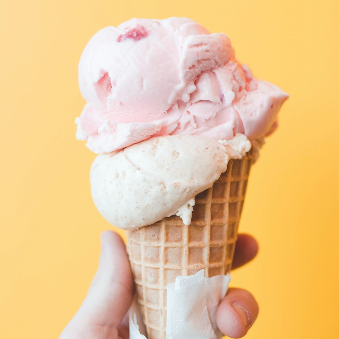 A dynamic 4K image featuring a car pulling up to the Mullins Short-Stop drive-up window. The focus is on the efficient and friendly service. A smiling employee is handing a burger and ice cream to the customer. The scene is brightly lit and full of energy. Camera angle: slightly angled, emphasizing the speed and convenience of the drive-up service. Style: modern and efficient, highlighting the ease of grabbing a quick meal.