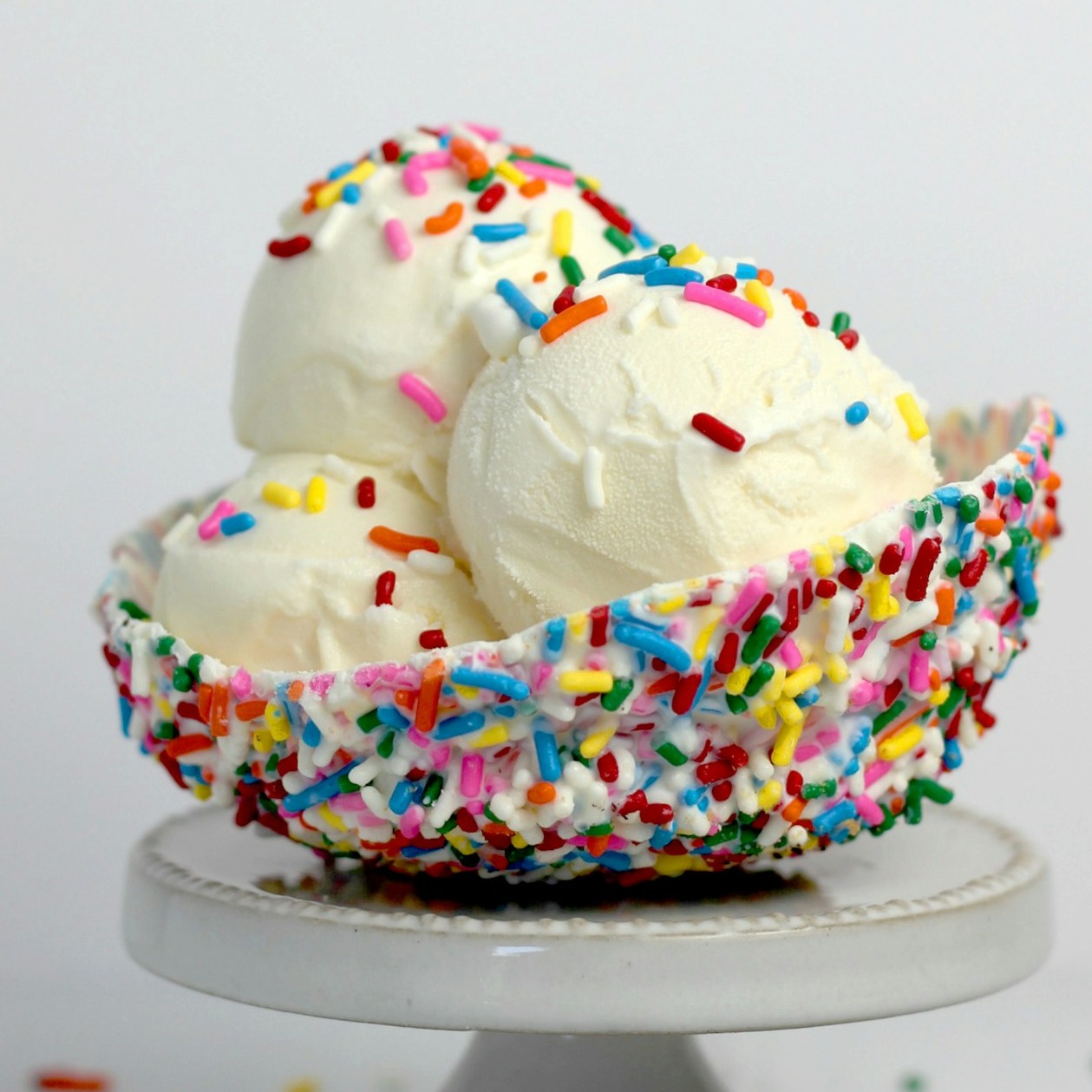 A 4K image depicting a close-up of a hand reaching out to receive a burger and ice cream cone through the drive-up window. The focus is on the exchange and convenience.