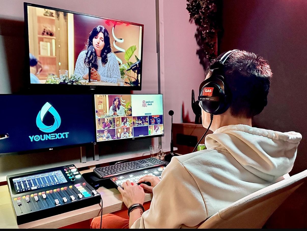 Show a group of young people building a bridge that connects two communities, symbolizing collaboration and progress. The bridge is strong and stable, representing a lasting solution to a common challenge. The camera angle should be a medium shot, capturing the scale of the bridge and the teamwork involved in its construction. Style reference: Engineering photography, emphasizing strength and collaboration. Technical specs: High resolution, photorealistic.