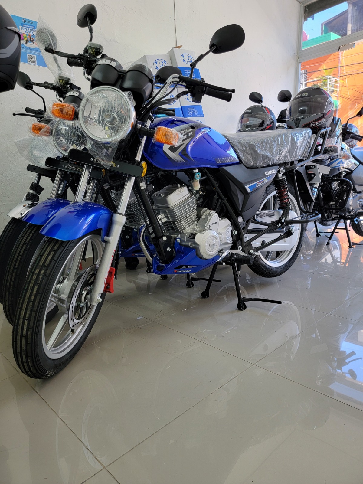 Create an image depicting different credit offers being compared side-by-side using tablets or screens, highlighting key features and benefits. A subtle background includes a motorcycle dealership to connect to the core theme.