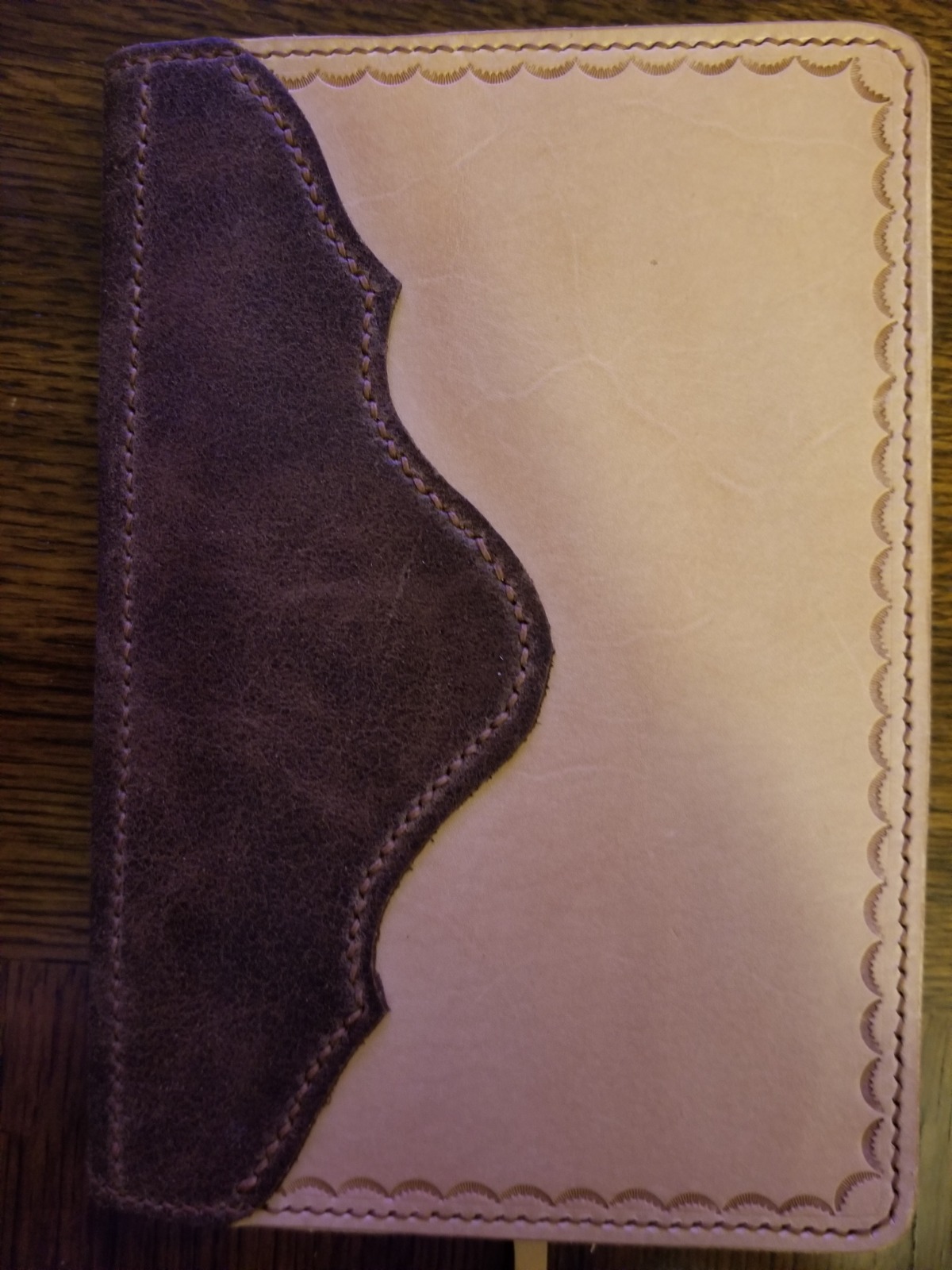 Create a photorealistic image showcasing a selection of handcrafted leather belts and wallets. The items should be arranged on a rustic wooden surface, with careful attention to composition and lighting. Highlight the quality of the leather, the precision of the stitching, and the overall aesthetic appeal. Style reference: Lifestyle product photography, emphasizing elegance and craftsmanship.