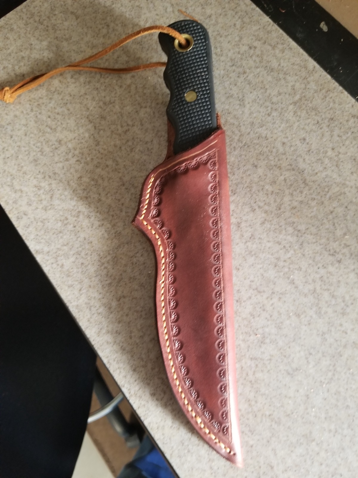 Depict a stylish arrangement of leather wallets, belts, and keychains on a clean surface. The composition should be visually appealing, showcasing the different styles and colors of the accessories. Soft, diffused lighting emphasizing the quality and craftsmanship. Style: Lifestyle product photography, emphasizing the fashionable aspect.