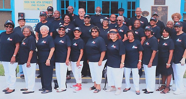 Trailblazers group photo in front of historic building