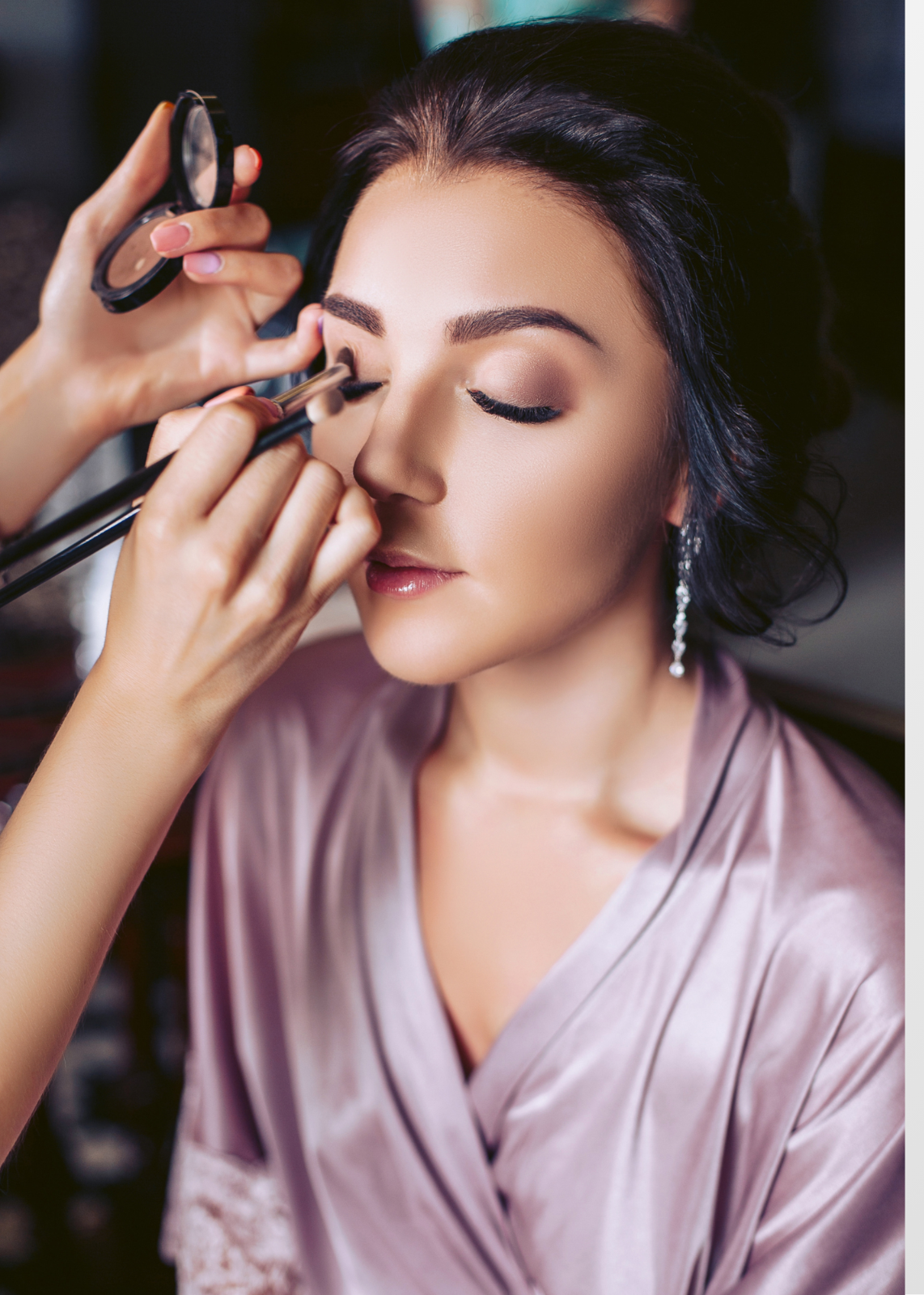 Photorealistic close-up of a makeup artist applying eyeliner with precision. Focus on the detail of the brush and the client's eye. Soft, diffused lighting. Palette of neutral tones with a pop of color. 4K resolution.