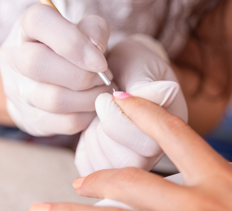 Hands receiving a manicure, showcasing detailed nail art design. Soft lighting, focus on texture, 4K resolution.