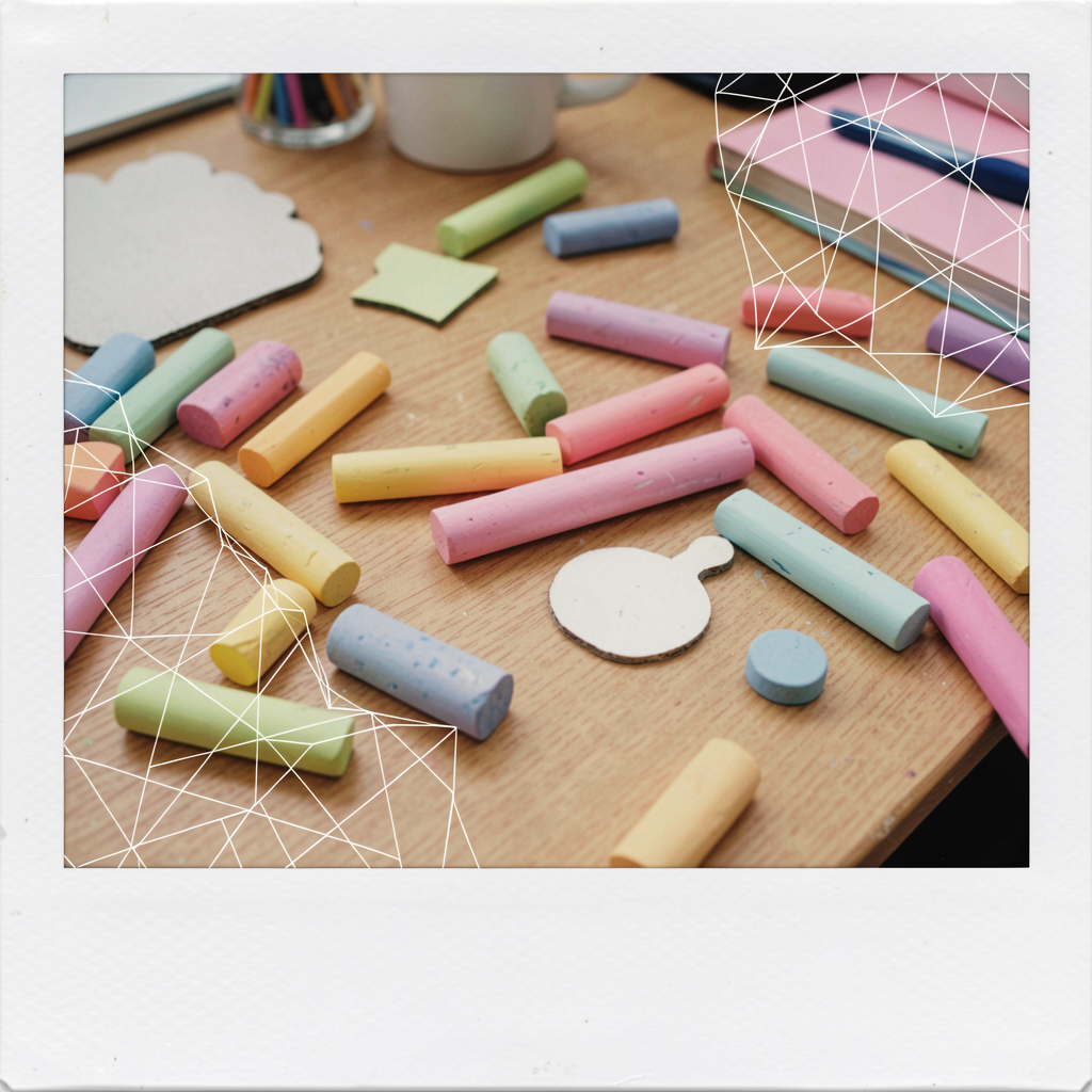 Creative artist workspace with chalks and shapes