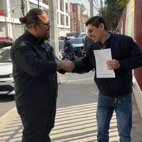 Create a photorealistic image depicting a diverse group of people gathered in a modern, open-concept kitchen in a newly renovated apartment. The scene should evoke a sense of community, warmth, and belonging. The people should be laughing, talking, and preparing a meal together. The kitchen should be well-lit and equipped with modern appliances. The overall composition should convey a sense of joy, connection, and the importance of finding the right home. Add subtle details such as family photos on the refrigerator and children's drawings on the wall to enhance realism. The style should be heartwarming, inviting, and relatable. Aim for 8K resolution and hyperrealistic detail.