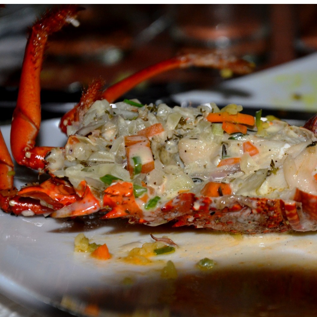 A photorealistic image depicting a beautifully decorated banquet hall filled with people celebrating. Tables are adorned with festive decorations and delicious food. The lighting is warm and inviting, creating a cheerful atmosphere. Capture the joy and excitement of the event. 4K resolution.