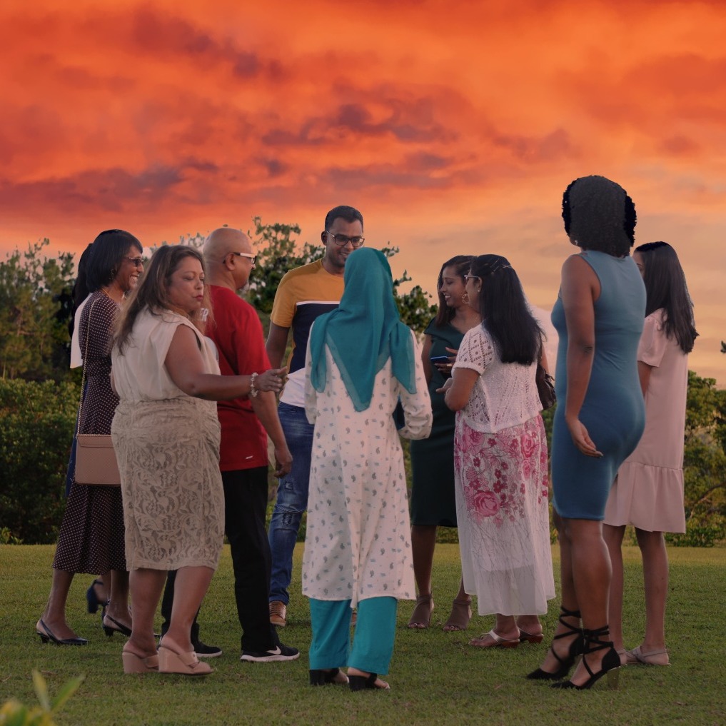 A vibrant and joyful scene of a family fun day in a park. Children are playing games, families are enjoying picnics, and everyone is laughing and having a great time. Bright, natural lighting enhances the cheerful atmosphere. 4K resolution.