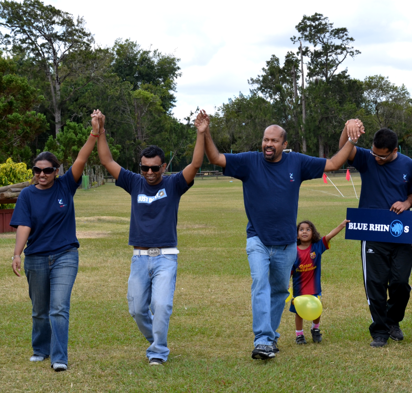 A photorealistic image showing MRASWA staff members participating in a team-building activity, such as a ropes course. The image should convey a sense of teamwork and challenge. The lighting is bright and natural, and the color palette is earthy and adventurous. 4k resolution.
