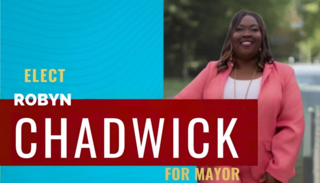 A professional headshot of Robyn Chadwick with a blurred background of a Spring Lake town hall meeting, subtly signifying her experience. The lighting is professional and balanced, highlighting her confidence and trustworthiness. The color palette is neutral and sophisticated. The style is modern and clean. 4K resolution, high quality.
