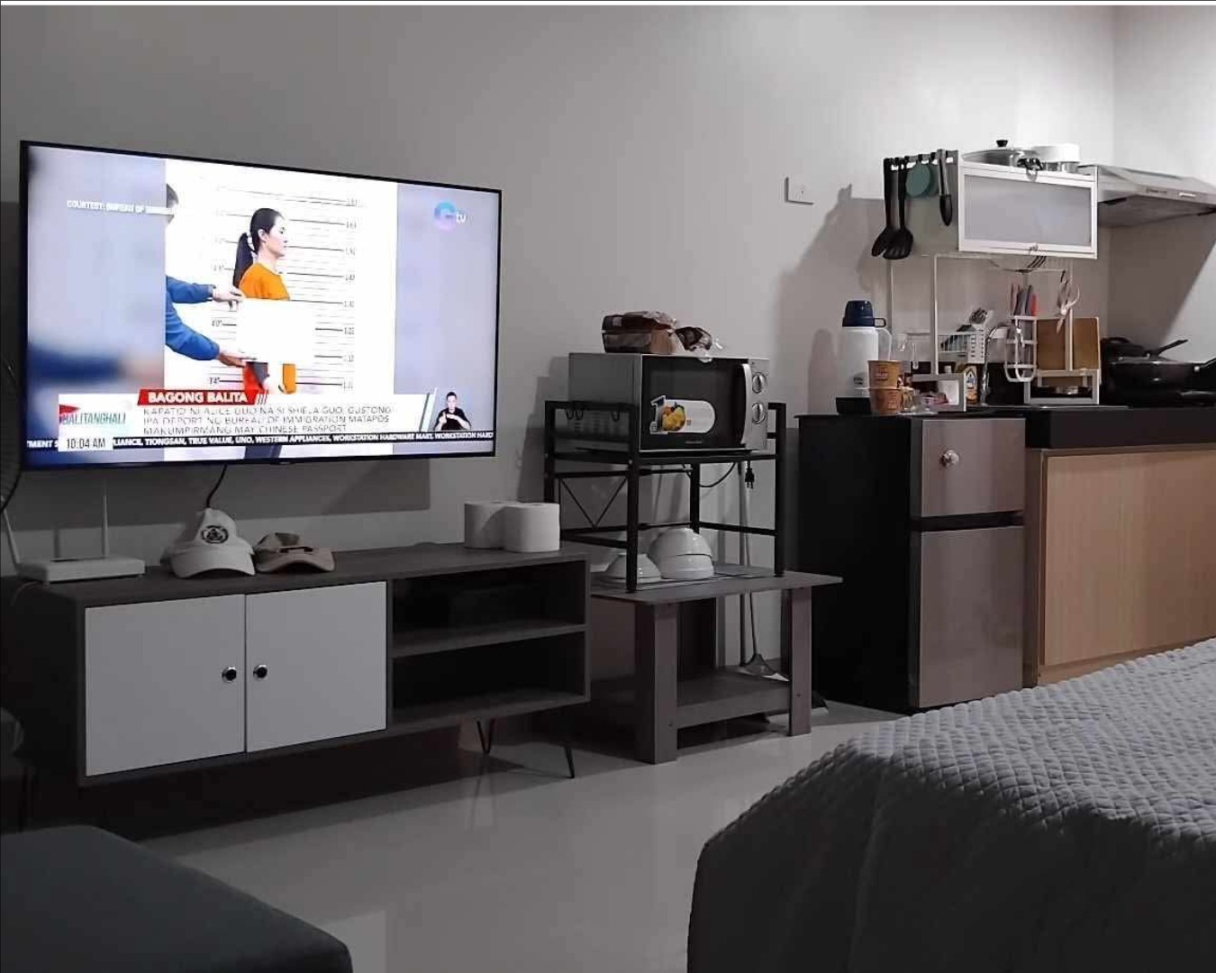 Photorealistic image of a modern, fully equipped condominium kitchen. Stainless steel appliances, granite countertops, and ample counter space. Focus on showcasing the functionality and style of the kitchen. Style: Clean, modern, and inviting. Lighting: Bright and natural. 4K resolution.