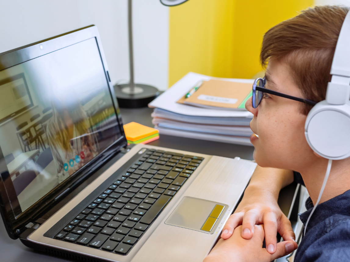 A photorealistic image of a dynamic online French class in session. Diverse students are actively participating, with Corinne leading the discussion from her home studio. Use warm lighting to create an inviting atmosphere. The focus should be on interaction and engagement.