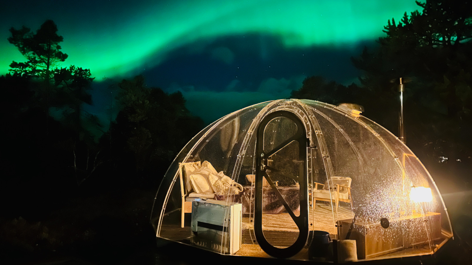  Imagine an exquisite private dining experience aboard a lavish yacht amidst the stunning Arctic landscape. The table is adorned with fine china, crystal glassware, and gourmet dishes, all set against the backdrop of a quiet fjord and icy cliffs. The lighting is soft and atmospheric, creating an intimate ambiance as the sun sets on the horizon. The color palette should feature rich blues and whites, emphasizing the pristine surroundings, while elegant decorations such as flowers or candles enhance the scene's opulence. This photorealistic image should transport viewers into a world of luxury and comfort.