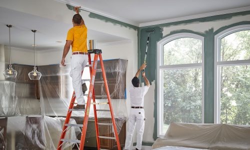 A stylized image showcasing a selection of premium painting and drywall materials. The composition should feature cans of high-quality paint, sheets of durable drywall, and professional-grade tools. The lighting should be dramatic, highlighting the textures and colors of the materials. The color palette should be vibrant and eye-catching. The camera angle should be a medium shot, capturing the arrangement of the materials in an artful way. Style reference: Product photography with an emphasis on luxury and quality. The image should convey ABC's commitment to using only the best materials.
