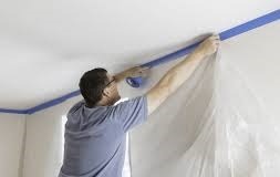A photorealistic image of ABC's team during a training session on commercial drywall installation. The image captures the team learning from a senior professional. The lighting should be bright and focused, highlighting the skill and precision of the trainers. The color palette should be neutral, conveying the serious commitment to professional development. The camera angle should be a medium shot, capturing the team learning. Style reference: Documentary photography with an emphasis on authenticity and skill development. The image should convey ABC's commitment to training and expertise.
