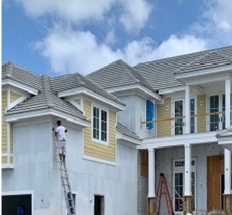 A photorealistic image showcasing a newly renovated commercial building with people inside engaged in various business activities. The image should capture the vibrant and productive atmosphere of the space. The lighting should be warm and inviting, highlighting the building's modern and functional design. The color palette should be rich and vibrant, showcasing the building's architectural details. The camera angle should be a wide shot, capturing the entire scene from a slightly elevated perspective. Style reference: Architectural photography with an emphasis on business success. The image should convey ABC's ability to enhance the value and appeal of a commercial property.
