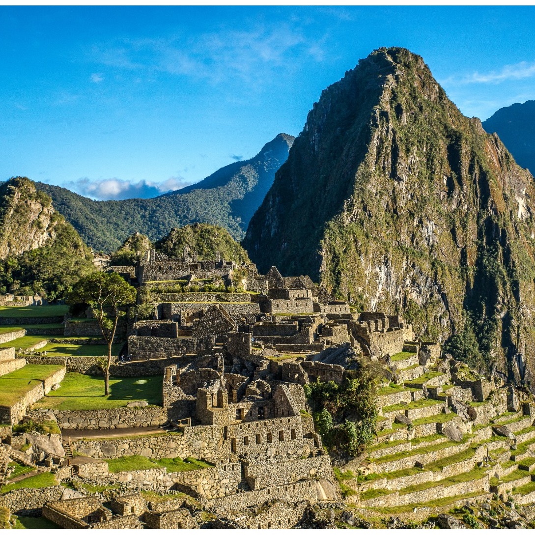 Photorealistic image featuring a small Andean village nestled in a valley. Focus on a group of indigenous people dressed in traditional clothing, engaged in daily activities like weaving or farming. The background should include traditional adobe houses and terraced fields. The lighting should be warm and golden, conveying a sense of community and tradition. The camera angle should be eye-level, allowing for a personal connection with the subjects. Pay attention to details like the texture of the clothing, the architecture of the houses, and the expressions on the faces of the villagers. Style: Evoke a sense of cultural immersion and authenticity. Technical specs: 8K resolution, hyperrealistic.