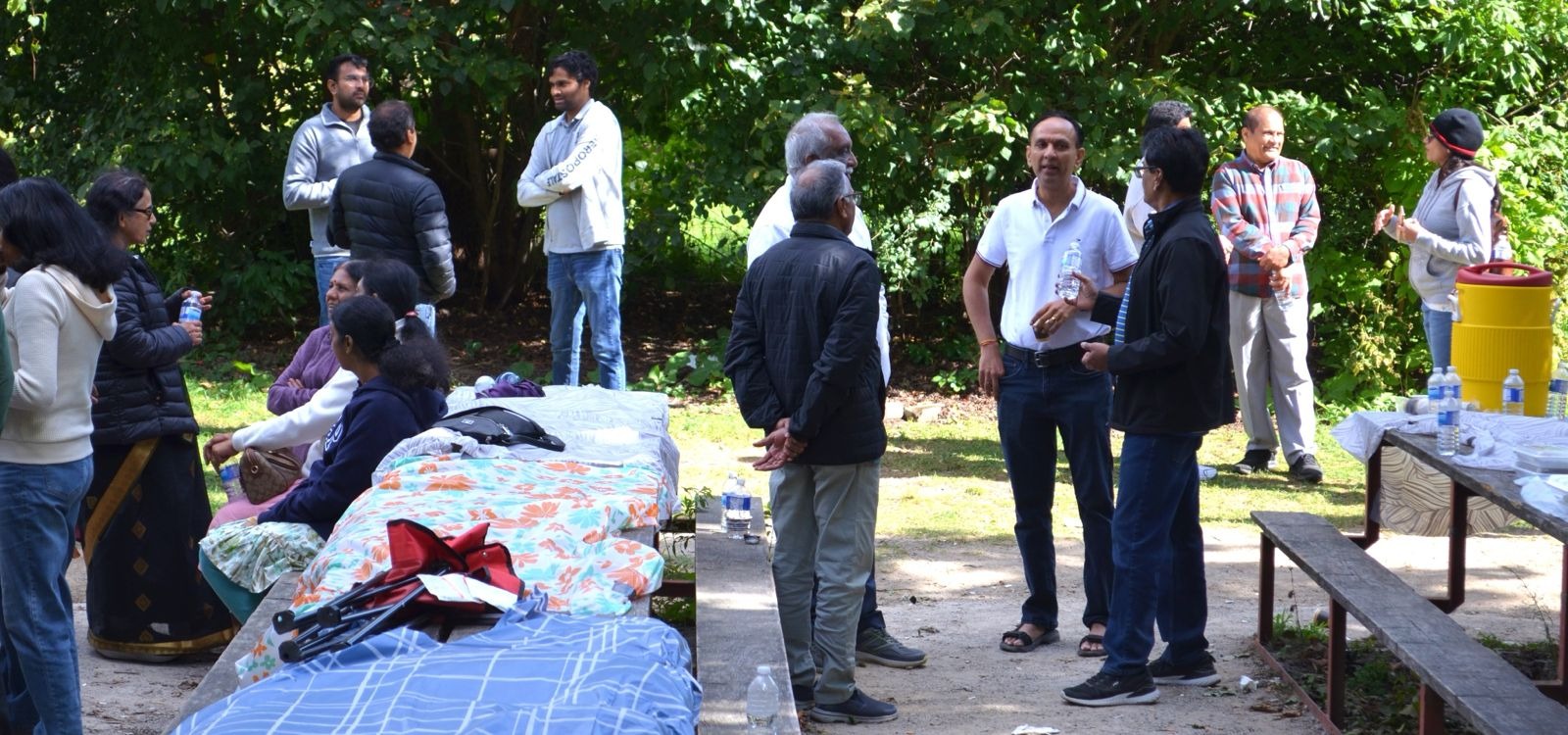 Create a photorealistic image of a Kammavar cultural celebration, featuring traditional dancers, music, and colorful attire. Focus on capturing the energy and excitement of the event. The lighting should be dramatic and dynamic. 4K resolution, high quality.