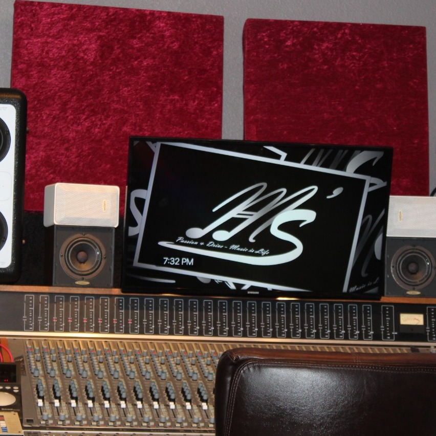 Visualize a state-of-the-art audio production studio, complete with mixing consoles, microphones, and soundproofing. Focus on the technical aspects of audio production, such as waveforms, frequency analyzers, and audio editing software. The color palette should be professional and modern, with a focus on blacks, grays, and blues. Technical specs: 4K resolution, high quality rendering.